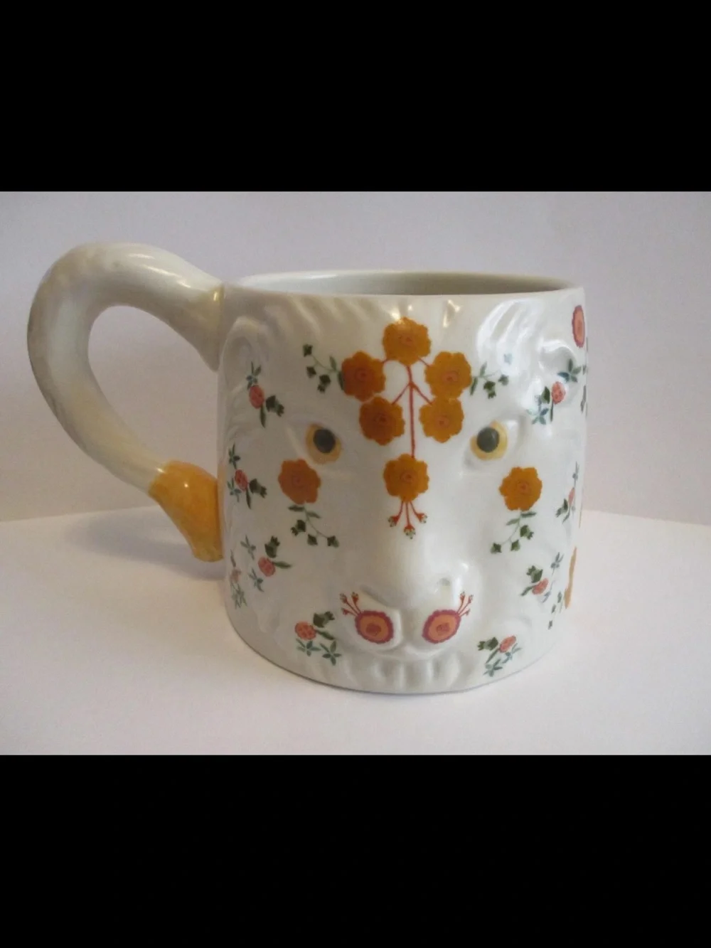 Anthropologie “Marisol Lion”  Motif and Green Leaves